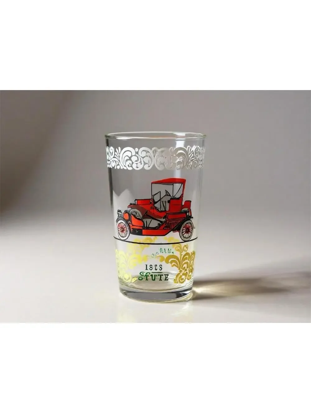 Vintage glass tumblers with early automobile designs 3